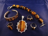 Sterling Silver and Tiger Eye Jewelry Group: (3) Rings, Pendant, (2) Bracelets