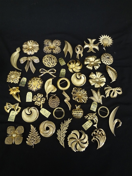 (40) Trifari Jewelry Goldtone Brooches
