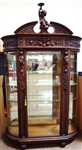 Styled After R.J. Horner Bevel Demilune Curio Cabinet Putti Finial Center