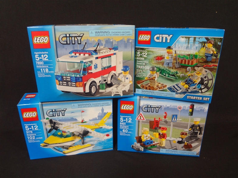 (4) LEGO Unopened Sets: 60066 Swamp Police Station, 8401 Minifigure Collection, 3178 Seaplane, 7890 Ambulance