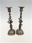 Pair Baroque Silver High Repousse Putti Candle Sticks