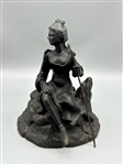 Cast Iron Figurine of Woman With Shepherds Hook on Rock