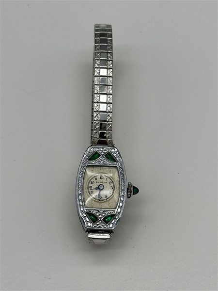 Bulova Ladies Watch With Clear Movement Cover and Green Stone Accent