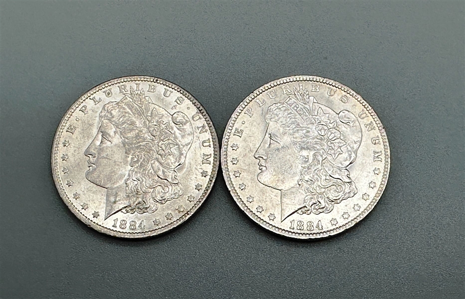 (2) 1884-O Morgan Silver Dollars