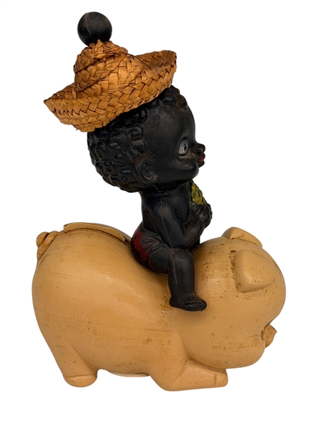 Black Americana Plastic Baby Riding a Pig
