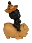 Black Americana Plastic Baby Riding a Pig